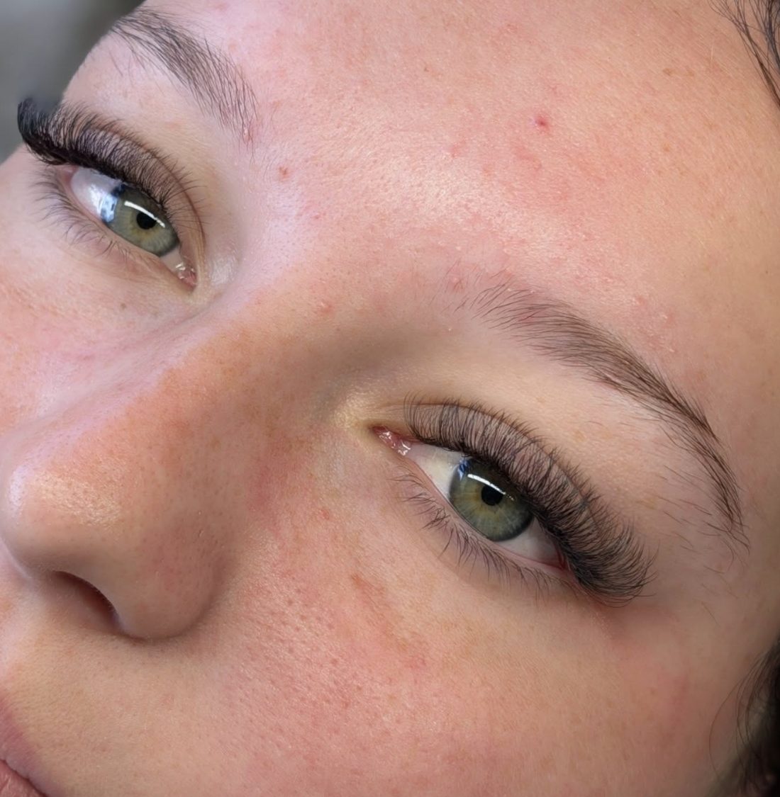 Close-up of laminated, brushed-up brows